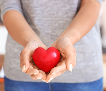 Woman holding red heart, closeup.  Health care conceptの写真素材