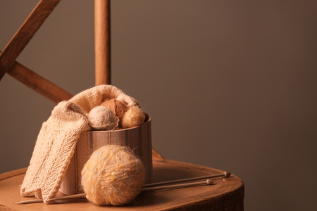 Box with knitting threads on chairの写真素材
