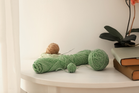 Set of knitting threads on tableの写真素材