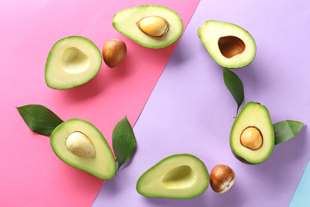 Flat lay composition with ripe avocados on color backgroundの写真素材