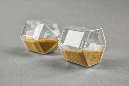Hourglass on grey background. Time management concept