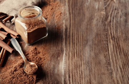 Composition with cinnamon on wooden backgroundの写真素材