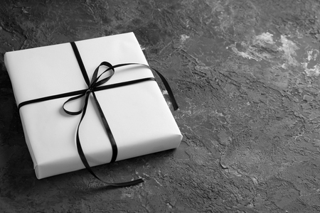 Beautiful gift box on grey textured backgroundの写真素材