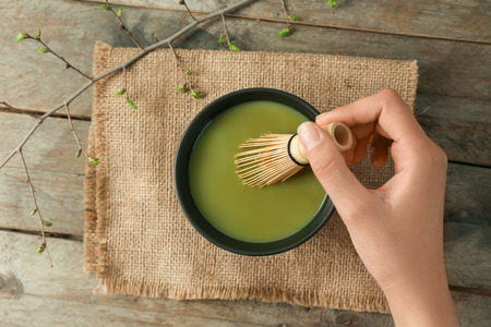 Woman preparing matcha tea, closeupの写真素材