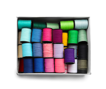 Box with colorful sewing threads on white backgroundの写真素材