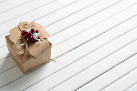 Beautiful Christmas gift box on white wooden backgroundの写真素材