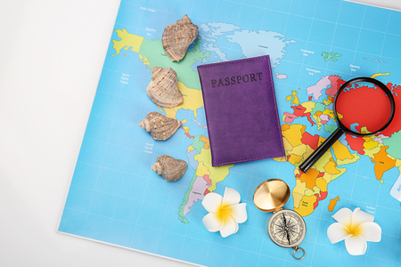 Composition with world map, passport and compass on white background. Travel planning conceptの写真素材