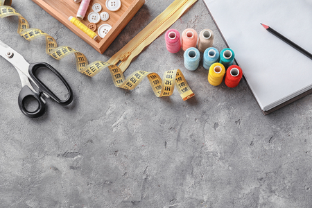 Sewing accessories on grey backgroundの写真素材