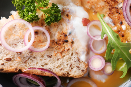 Toasted bread with fried egg, closeupの写真素材