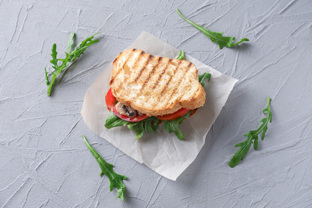 Tasty sandwich on textured tableの写真素材