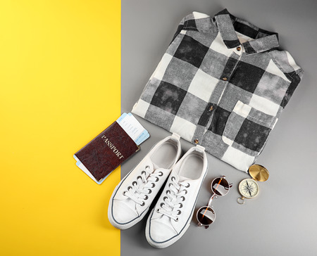 Composition with tourist's stuff on color backgroundの写真素材