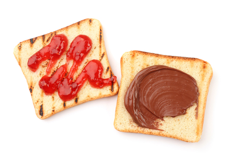 Delicious toasts with jam and chocolate paste on white backgroundの写真素材