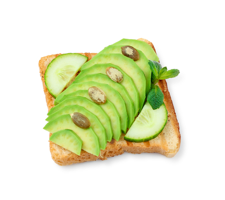 Delicious toast with avocado and cucumber on white backgroundの写真素材
