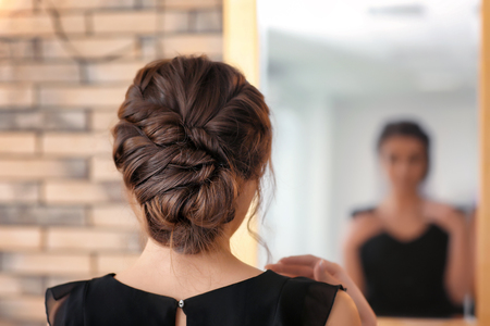 Woman with beautiful hairdo made in professional salonの写真素材