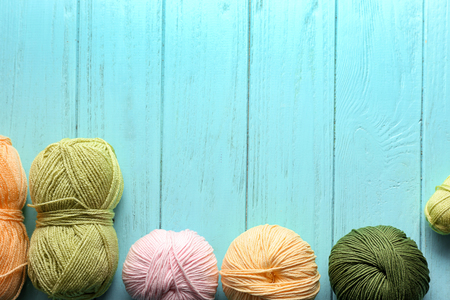 Colorful knitting yarn on wooden tableの写真素材
