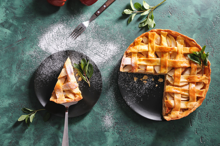 Composition with tasty apple pie on textured tableの写真素材