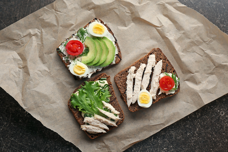 Composition with delicious toasts on tableの写真素材