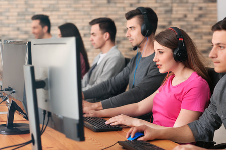 Young people playing video games at tournamentの写真素材