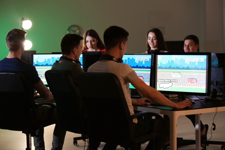 Young people playing video games at tournament