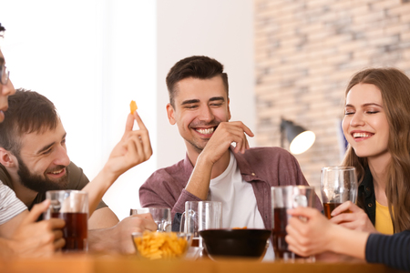 Friends drinking beer in barの写真素材