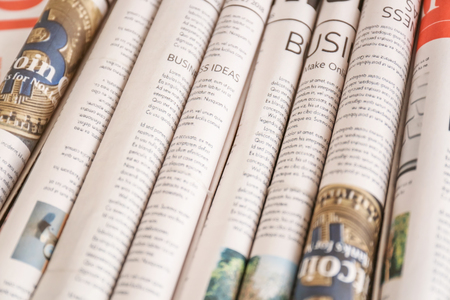 Various rolled newspapers, closeupの写真素材