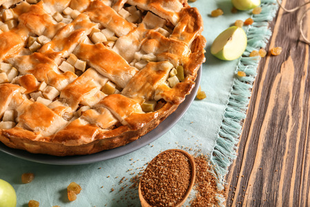 Plate with delicious apple pie on wooden table, closeupの写真素材