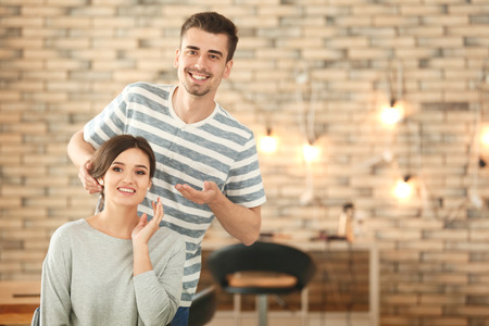 Professional hairdresser working with client in beauty salonの写真素材