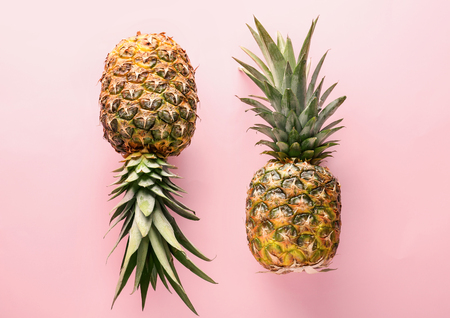 Delicious pineapples on color backgroundの写真素材