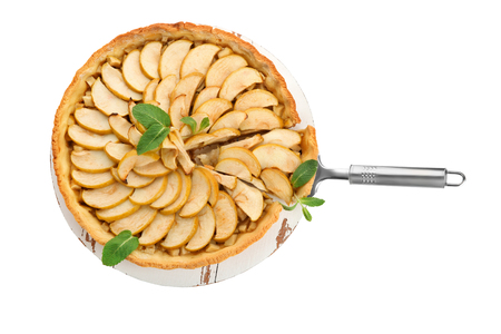 Wooden board with tasty homemade apple pie on white backgroundの写真素材