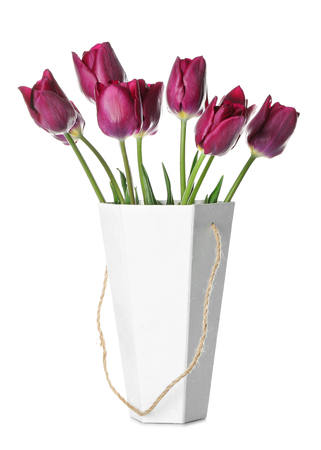 Vase with beautiful tulips on white backgroundの写真素材
