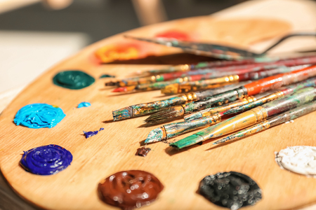 Palette and brushes in artist's workshop, closeupの写真素材