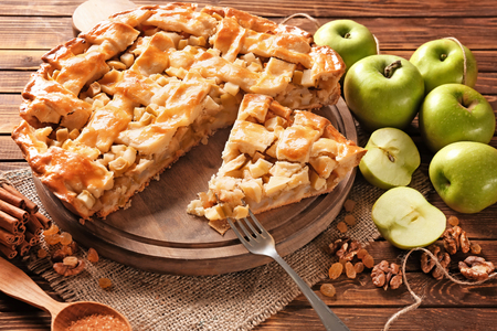 Tasty homemade apple pie on wooden tableの写真素材