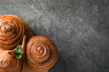 Sweet cinnamon buns on grey backgroundの写真素材