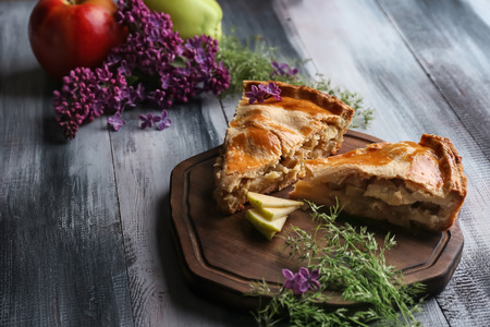 Pieces of apple pie on wooden boardの写真素材