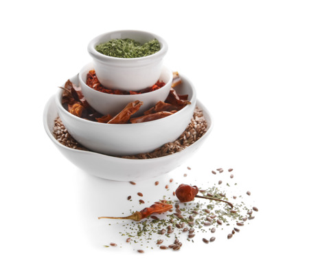 Bowls with different spices on white backgroundの写真素材