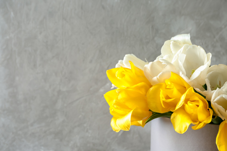 Vase with beautiful tulips on grey backgroundの写真素材