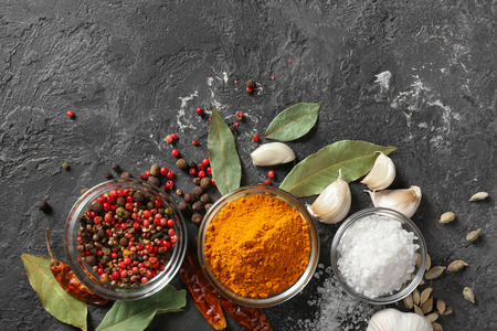 Bowls with various spices on grey backgroundの写真素材
