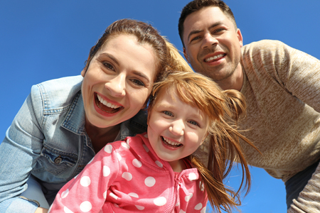 Happy family outdoors on sunny dayの写真素材