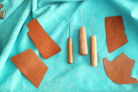 Set of tools on leather in workshop