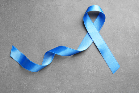 Blue ribbon on grey background. Prostate cancer awarenessの写真素材