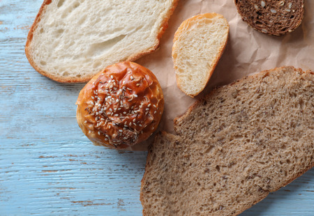 Sliced bakery products on wooden background, closeup