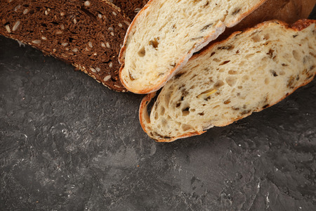 Variety of fresh tasty bread on table
