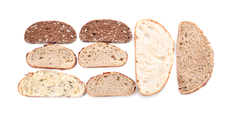 Different bread pieces on white backgroundの写真素材