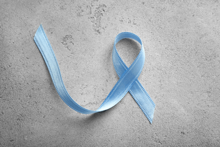 Blue ribbon on grey background. Prostate cancer conceptの写真素材