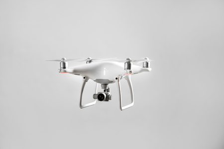 Modern quadcopter on grey backgroundの写真素材