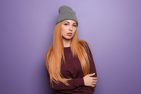 Beautiful young woman on color backgroundの写真素材