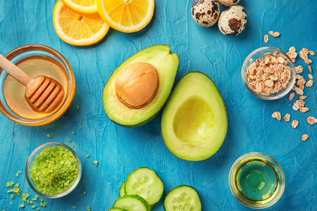 Avocado with ingredients for natural homemade cosmetics on color backgroundの写真素材