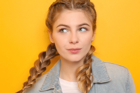 Beautiful young woman on color background
