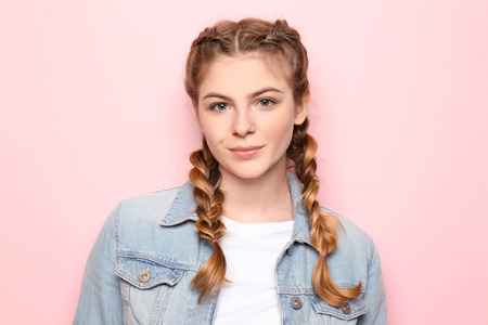 Beautiful young woman on color backgroundの写真素材