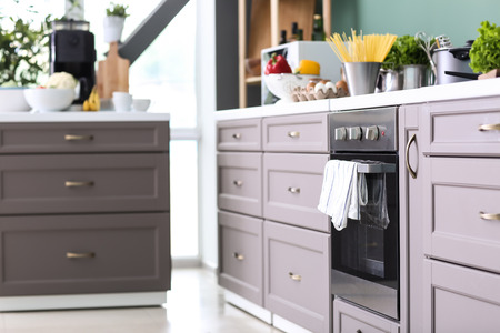 Modern furniture with kitchenware and products indoorsの写真素材